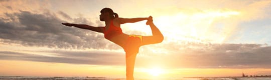 Yoga on the beach at sunset